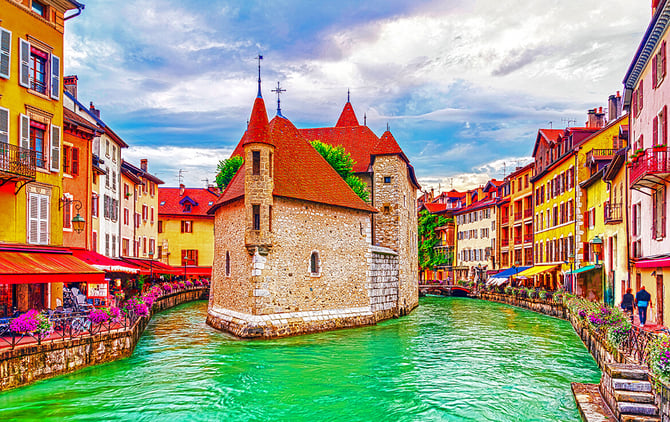 View of the river flowing through old town Annecy, France, known as "The Venice of the Alps."